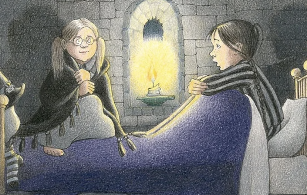 Jill Murphy's The Worst Witch illustration, depicting Mildred Hubble in bed talking to her best friend, who is wrapped in a cloak. The room is bathed in candlelight.